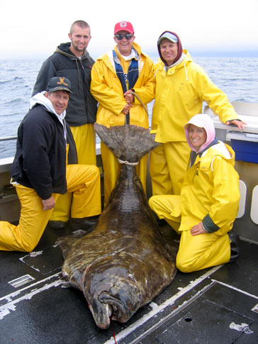 The family poses with their halibut
