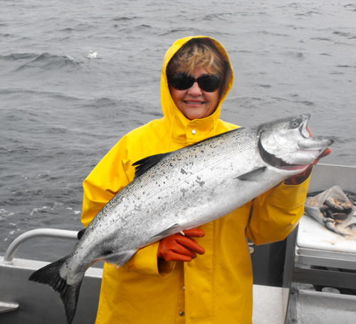 06 26 2009 Fisherwoman of the day with the best King Salmon Halibut and throw back Ling Cod on the boat