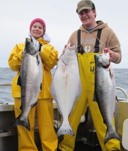 Ina Mae And Martin Holding King Salmon And Halibut