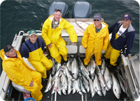 A group of our clients with a fine catch of silver salmon in Alaska